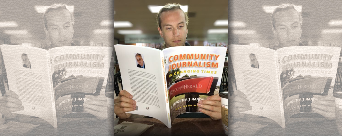 Journalist in coffee shop studying Community Journalism In Changing Times. Learning as he works: on the go. Journalist in coffee shop studying Community Journalism In Changing Times. Learning as he works: on the go.